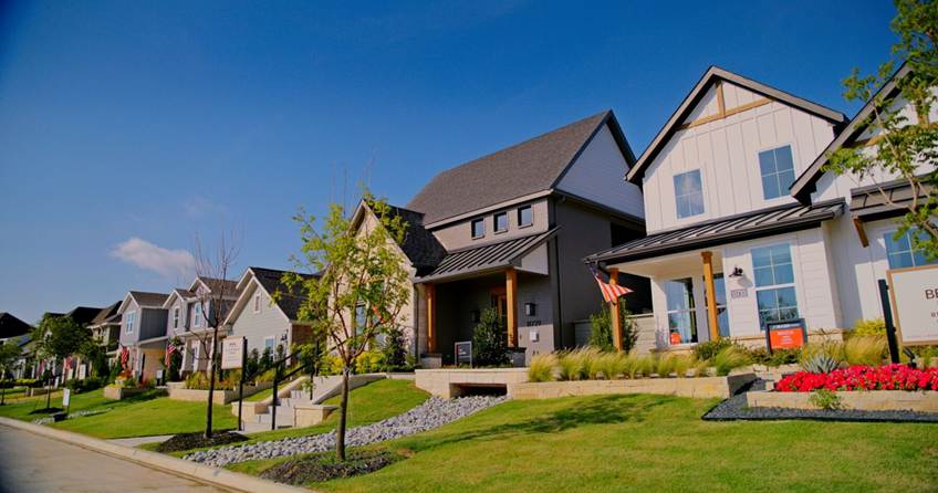 A row of newly built townhomes in Denton, TX, featuring the text overlay: "Checklist for a 48-Hour Turnover: A Must-Read for Denton Realtors!" Provided by Denton Maids to promote professional real estate turnover cleaning.